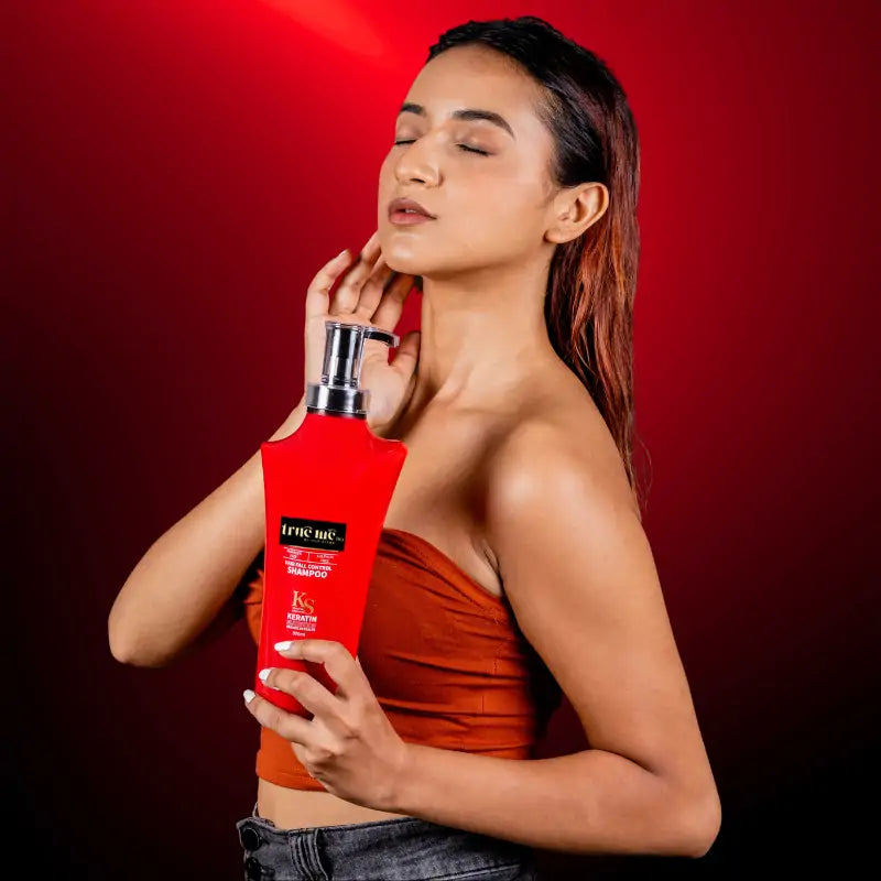 Eva Giri holding true me hair fall control shampoo 