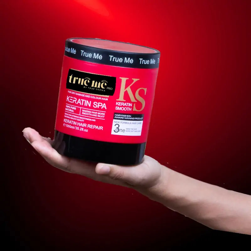 a hand held TrueMe Hair Treatment Keratin Spa