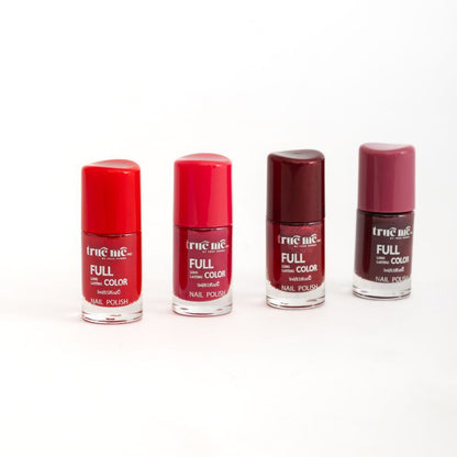 A set of four nail polishes in a line, with the bottle tips showing the color of each polish, from left to right: red, maroon, purple, and black.