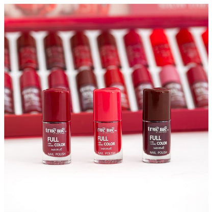 A set of 3 nail polishes in a line, with the bottle tips showing the color of each polish, from left to right:  maroon, red and brown.