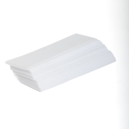 A stack of white non-woven waxing strips against a white background.